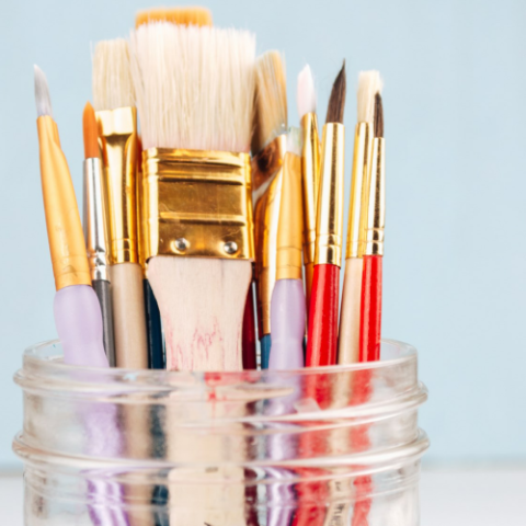 image of paintbrushes in a jar