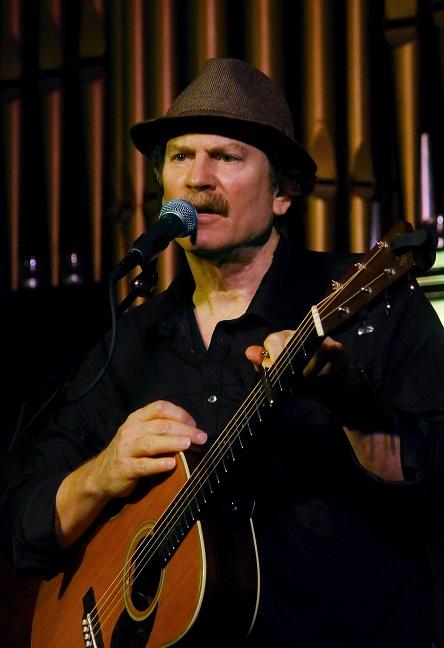 Author and musician Rob McHale with his guitar